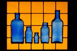 Stained Glass Window Panel with Antique Cobalt Blue Medicine Bottles