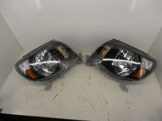 Anzo USA 121191 Toyota Tacoma Black with Amber Reflectors Headlight Assembly